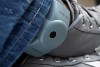 A tracking bracelet on a man's ankle.