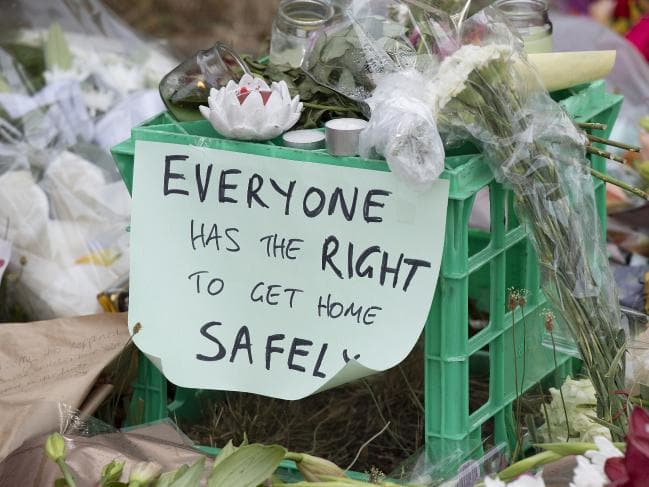 People leave floral tributes where the body of Aiia Maasarwe was found near the Polaris Shopping centre in Bundoora. Picture: Ellen Smith